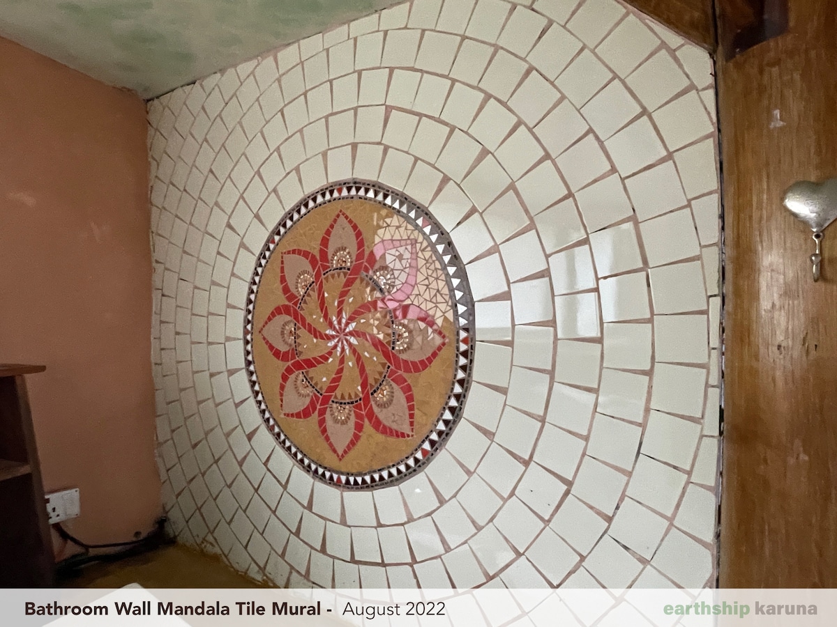 Hand-painted bathroom mandala — one of many artist-finished details inside the home