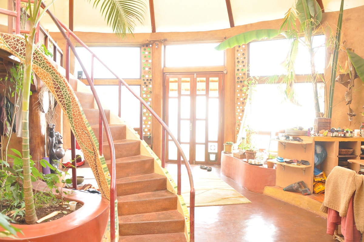 The hand-sculpted spiral staircase with bottle-glass feature walls